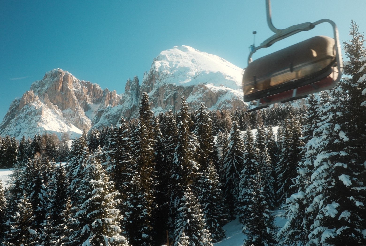 Chairlift above a snowy mountain